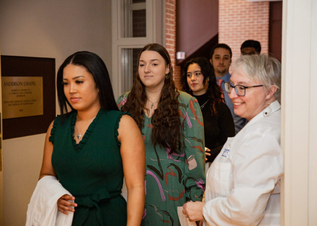 nursing students walking to graduation ceremony