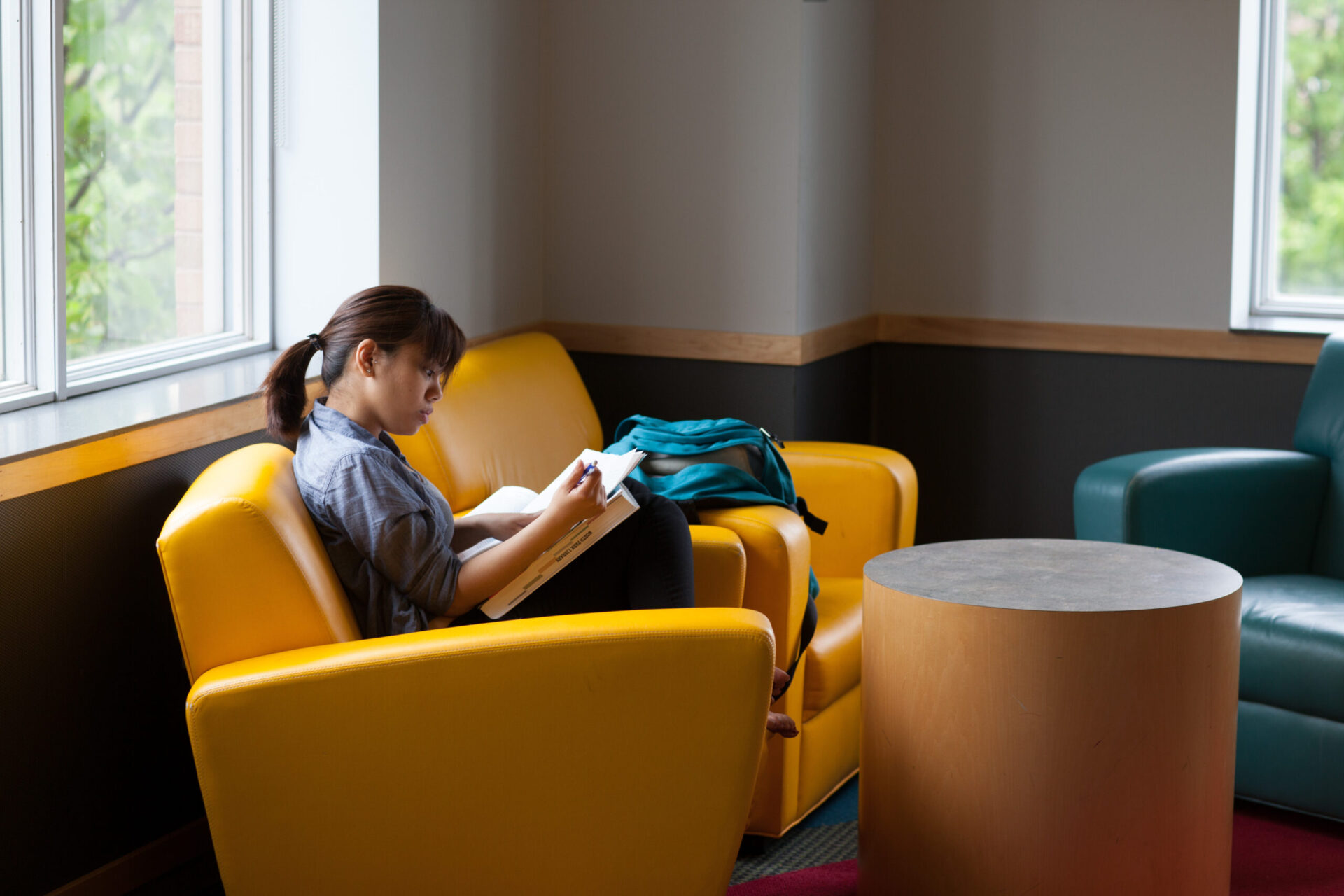 Student sitting in Brandel library